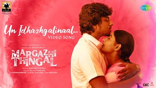 Un Idhazhgalinaal Song Lyrics